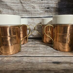 Vintage copper withceramic insert mugs.